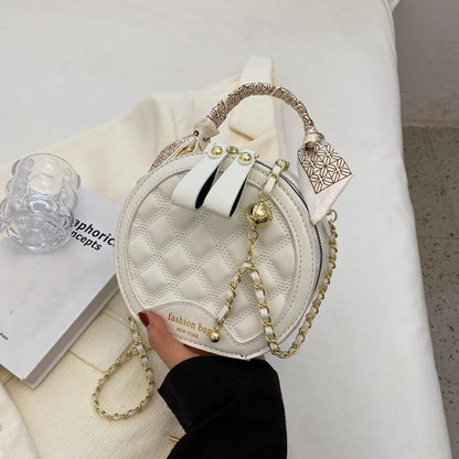 Petit sac rond brodé à motif losanges