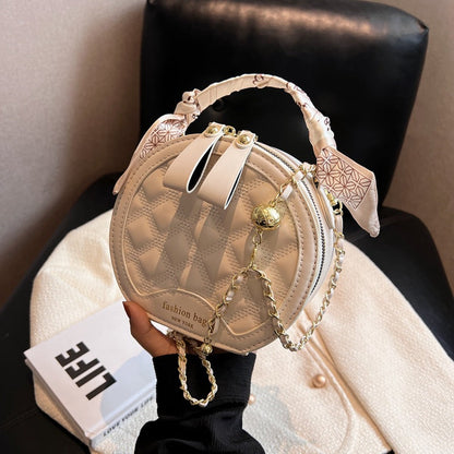 Petit sac rond brodé à motif losanges