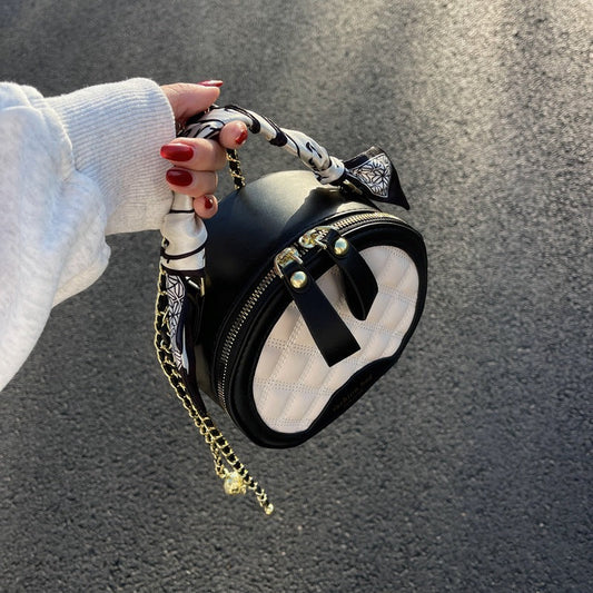 Petit sac rond brodé à motif losanges